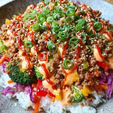 Bang Bang Ground Turkey Rice Bowls topped with vegetables and sauce for a flavorful meal.
