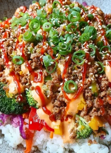 Bang Bang Ground Turkey Rice Bowls topped with vegetables and sauce for a flavorful meal.