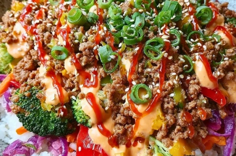 Bang Bang Ground Turkey Rice Bowls topped with vegetables and sauce for a flavorful meal.