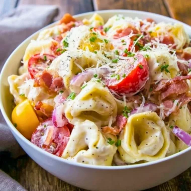 Delicious grinder tortellini salad with fresh vegetables and dressing
