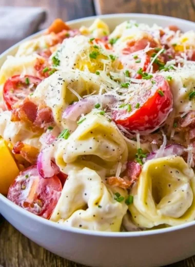 Delicious grinder tortellini salad with fresh vegetables and dressing