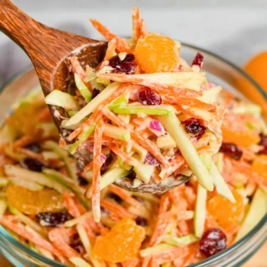 Colorful Carrot Apple Salad with fresh ingredients on a plate