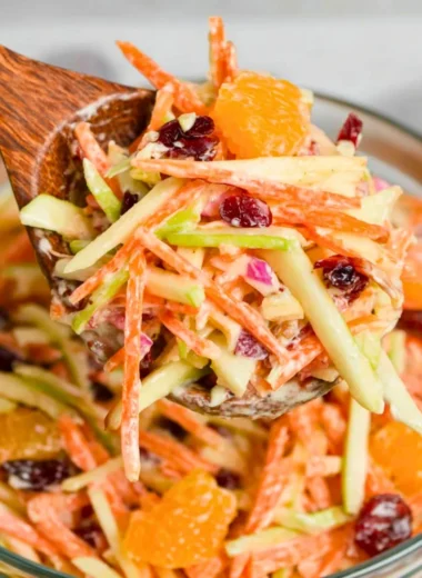 Colorful Carrot Apple Salad with fresh ingredients on a plate