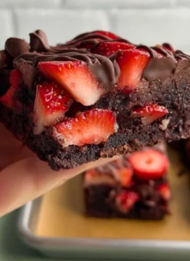 Delicious chocolate covered strawberry brownies topped with fresh strawberries