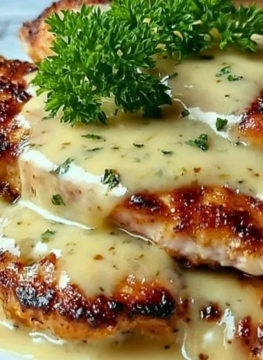 Crispy Malibu Chicken dish plated with herbs and sauces