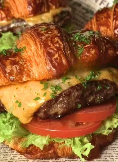 Delicious croissant smash burgers topped with fresh ingredients