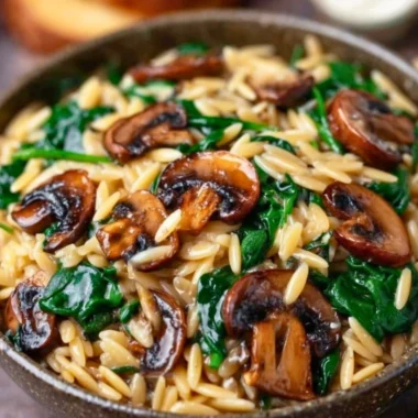Creamy Garlic Butter Orzo with Mushrooms and Spinach in a bowl