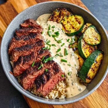 Delicious grilled steak bowl with zucchini and savory sauce