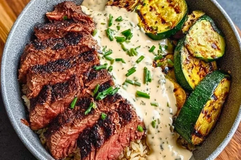 Delicious grilled steak bowl with zucchini and savory sauce