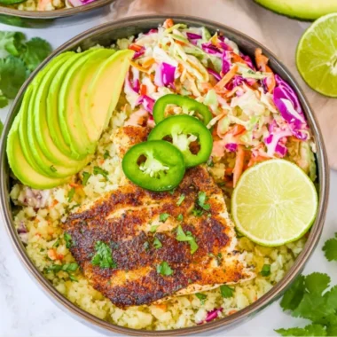 Low carb fish taco bowl with fresh ingredients and toppings