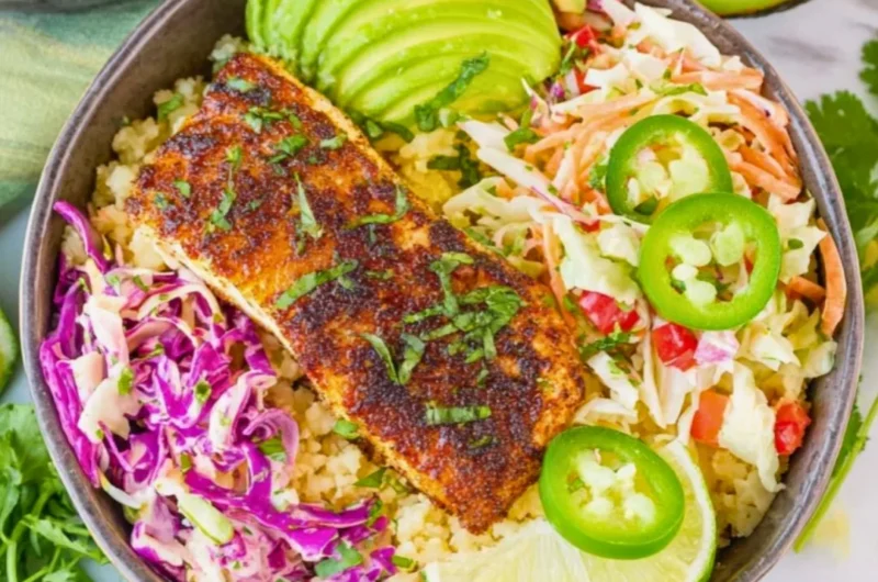 Delicious low carb fish taco bowls with fresh ingredients and vibrant toppings.