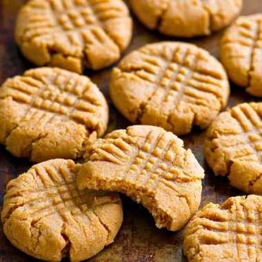 Soft and chewy keto peanut butter cookies on a baking tray.