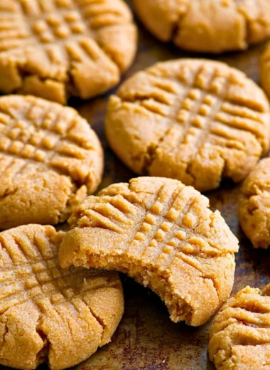Soft and chewy keto peanut butter cookies on a baking tray.