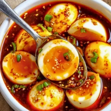 Delicious spicy gochujang eggs served on a plate with fresh herbs