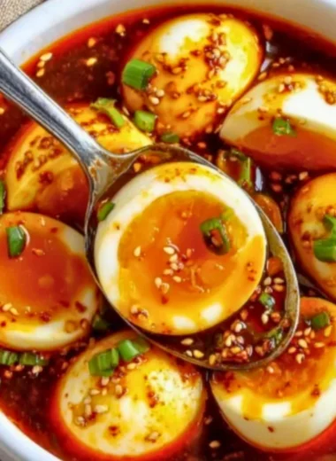 Delicious spicy gochujang eggs served on a plate with fresh herbs