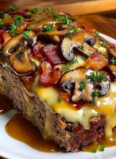 Delicious Swiss Bacon Mushroom Meatloaf served on a plate