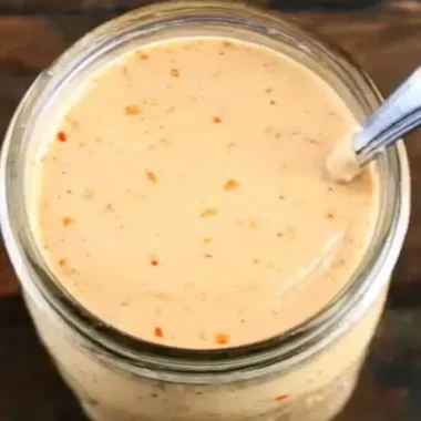 Bottle of Boom Sauce featuring a vibrant label with spicy sauce inside