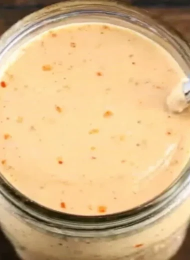 Bottle of Boom Sauce featuring a vibrant label with spicy sauce inside