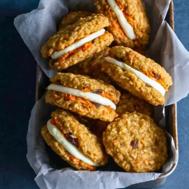 Delicious carrot cake cookies with cream cheese frosting on a plate