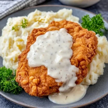 Delicious Chicken Fried Chicken served with sides on a plate.