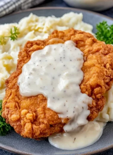 Delicious Chicken Fried Chicken served with sides on a plate.