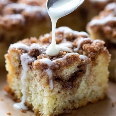 Delicious homemade coffee cake with a crumbly topping and coffee cup