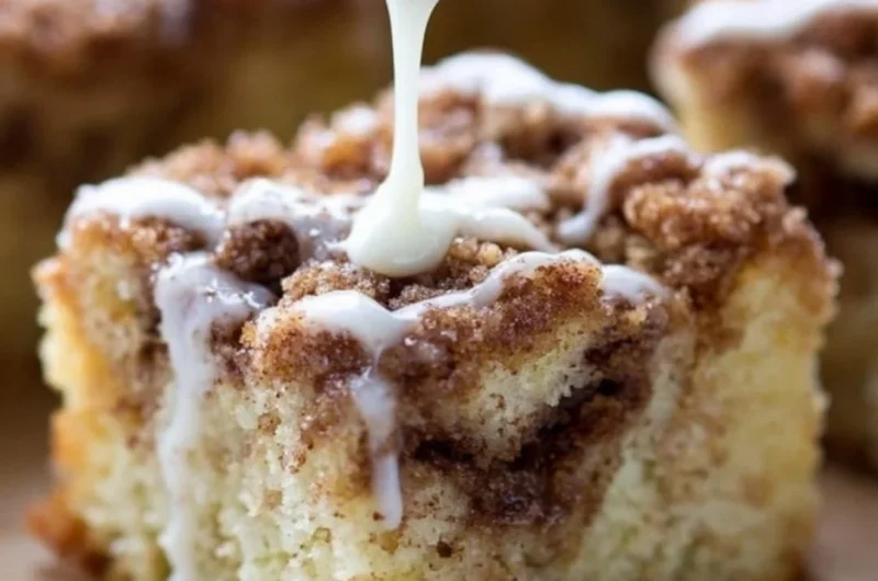 Delicious homemade coffee cake with a crumbly topping and coffee cup