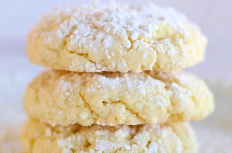Delicious cream cheese cookies on a plate, showcasing their soft texture and creamy topping.