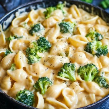 Creamy broccoli mac and cheese dish, featuring cheese and fresh broccoli