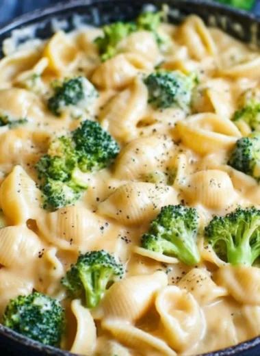 Creamy broccoli mac and cheese dish, featuring cheese and fresh broccoli