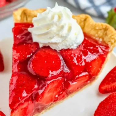 Easy Shoney’s strawberry pie served with fresh strawberries and whipped cream.