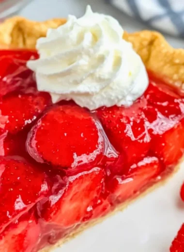 Easy Shoney’s strawberry pie served with fresh strawberries and whipped cream.
