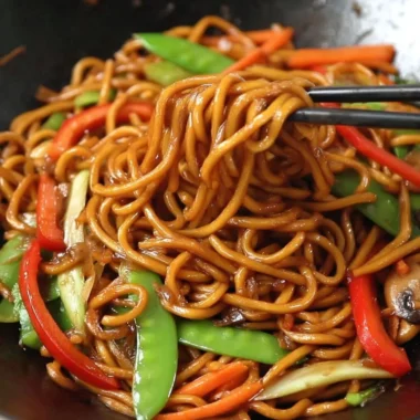 Delicious bowl of Lo Mein noodles with colorful vegetables and proteins