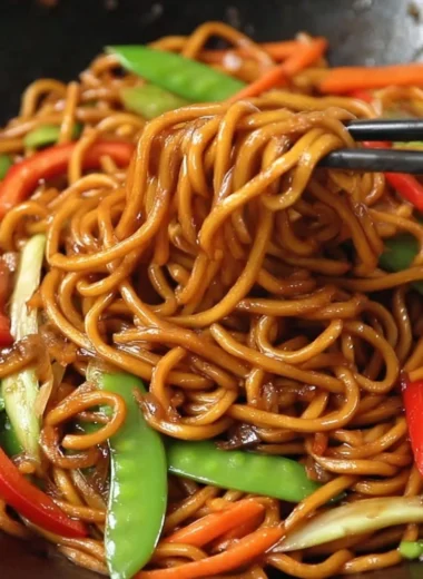 Delicious bowl of Lo Mein noodles with colorful vegetables and proteins