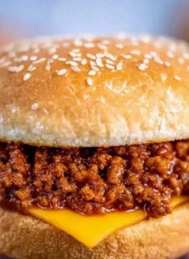 Delicious slow cooker sloppy joes served on a bun with fresh toppings