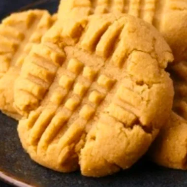 Freshly baked soft peanut butter cookies on a cooling rack