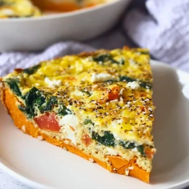 Spinach and Goat Cheese Quiche with Sweet Potato Crust served on a plate