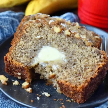 Delicious slice of Starbucks Copycat Banana Bread on a wooden table
