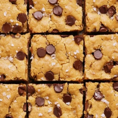 Delicious ultra flavorful blondies topped with chocolate and nuts.