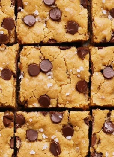 Delicious ultra flavorful blondies topped with chocolate and nuts.