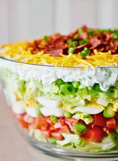 Delicious 7 Layer Salad featuring fresh vegetables and creamy layers