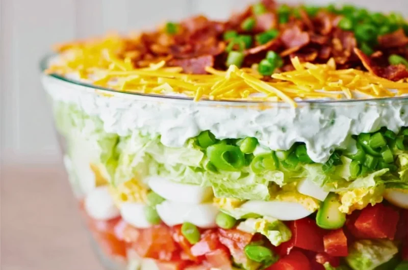 Delicious 7 Layer Salad featuring fresh vegetables and creamy layers