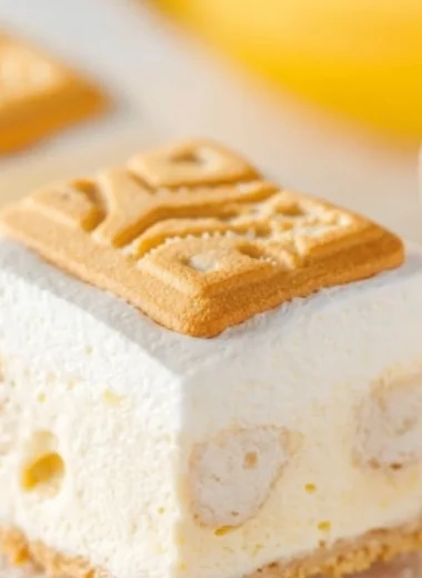 Delicious banana pudding served in a glass dish with fresh bananas and vanilla wafers