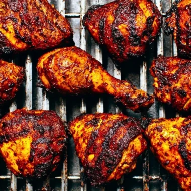Juicy and flavorful BBQ chicken on a grill, perfect for summer barbecues.