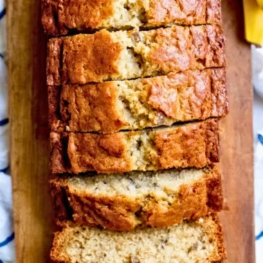 Delicious slice of homemade banana bread with chunks of bananas