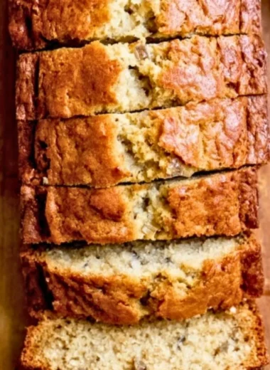 Delicious slice of homemade banana bread with chunks of bananas