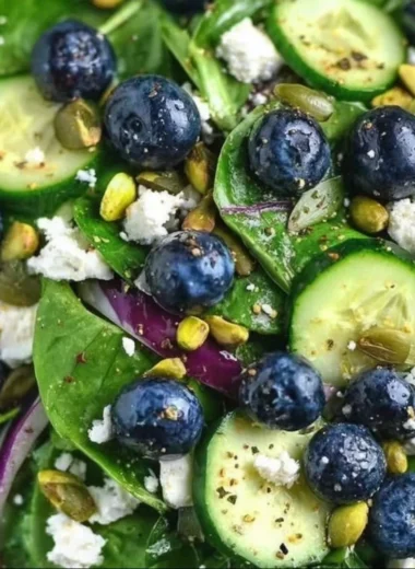 Blueberry pistachio spring salad with fresh greens and nuts