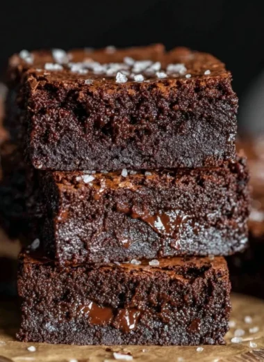 Decadent homemade brown butter brownies on a white plate