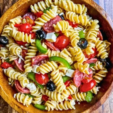 Bowl of Easy Italian Pasta Salad with fresh vegetables and dressing