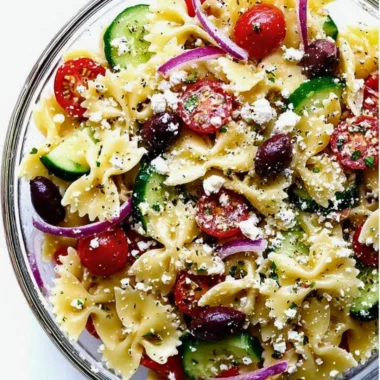 Colorful Mediterranean Pasta Salad with veggies and olives in a bowl